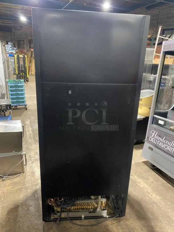 True TAC36 commercial black multi-tier refrigerated open merchandiser. Features stainless steel shelving, model TAC-36.