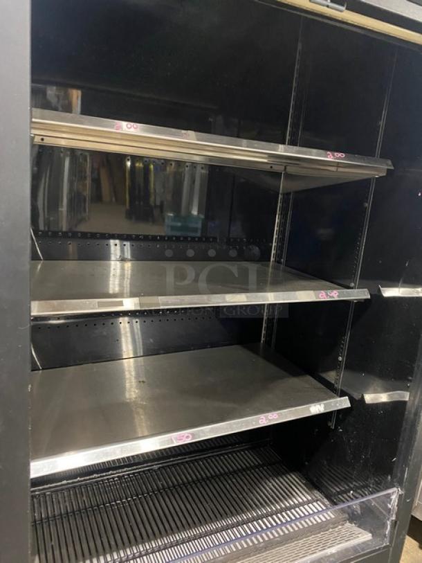 True TAC-36 black multi-tier refrigerated display case with stainless steel shelving, SN: 7546115, 208-230V, 1 Phase.