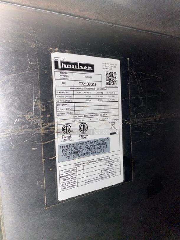 Traulsen 3-door refrigerated pizza prep table, stainless steel, Model TRP096S, with cutting board, overhead shelf, poly coated racks, on casters, 115V.