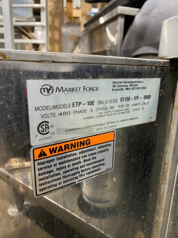 Market Forge ETP10E stainless steel electric dual compartment convection steamer, 480V, 3 phase, model info and warning label visible.