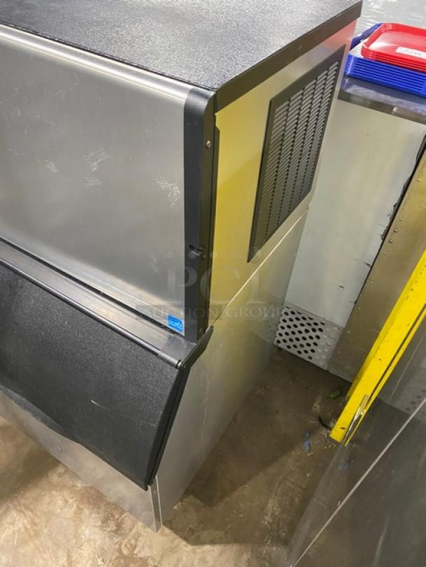 Ice-O-Matic stainless steel ice maker/bin combo, model ICE0400HA5, Energy Star certified, on legs, in used condition.