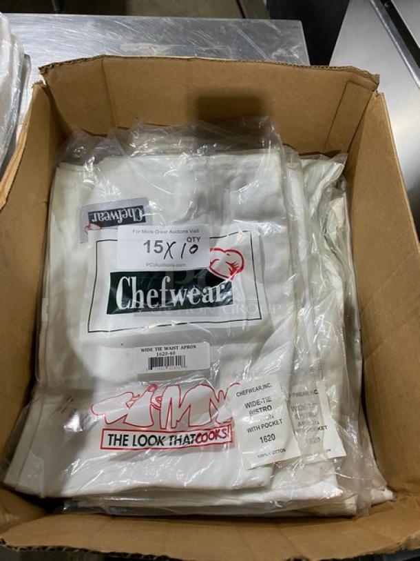 Chefwear CW1611 white waist apron with pockets in original packaging. New condition, multiple aprons in box.