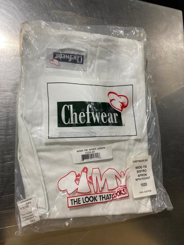 Chefwear Commercial White Bistro Apron with pockets, Model CW1611, new in packaging, 100% cotton, branded tags visible.