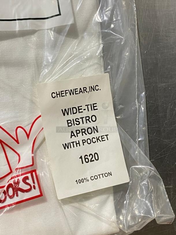 Chefwear CW1611 white bistro apron, 100% cotton, with pockets. New in packaging. Tag reads “Wide-Tie Bistro Apron with Pocket 1620.”