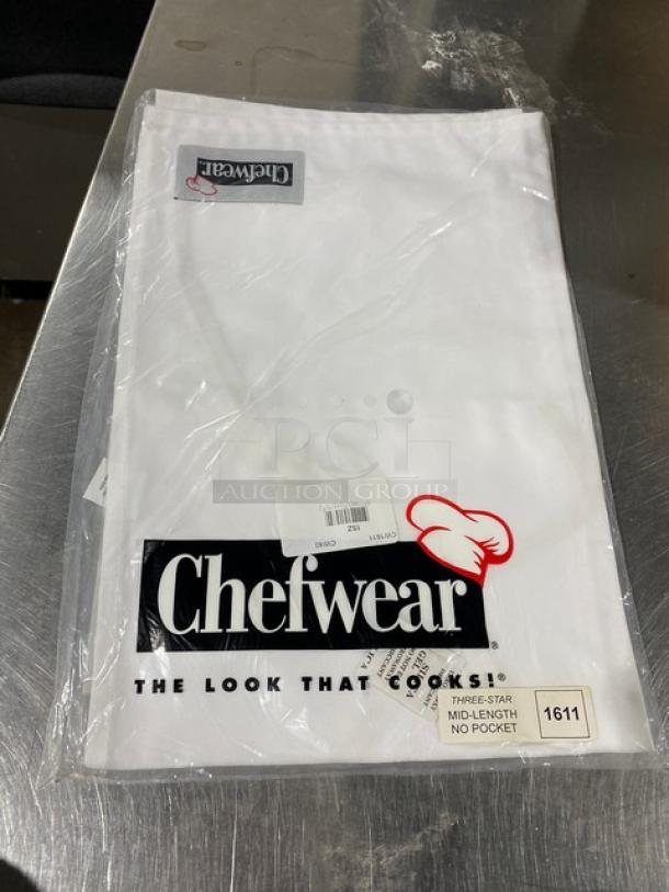 Chefwear white waist/bistro apron, model CW1611, new in packaging, mid-length, no pocket, Chefwear logo visible.