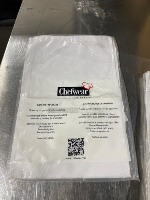 Chefwear Commercial White Waist/Bistro Apron CW1611, new in packaging, care instructions visible on front label.