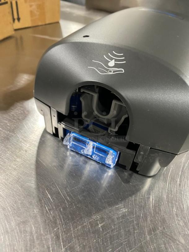 NEW Ecolab Nexa Series black touch-free hand hygiene dispenser, commercial use, pristine condition, motion sensor symbol.