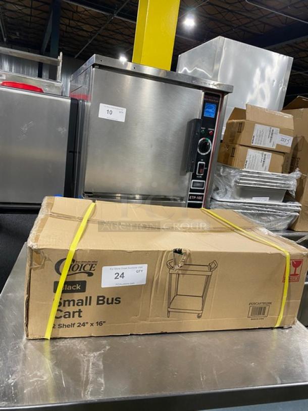 Choice Commercial 2 Shelf 24"x16" Black Small Bus Cart in box, new condition. Model on casters. Box shows brand and dimensions.