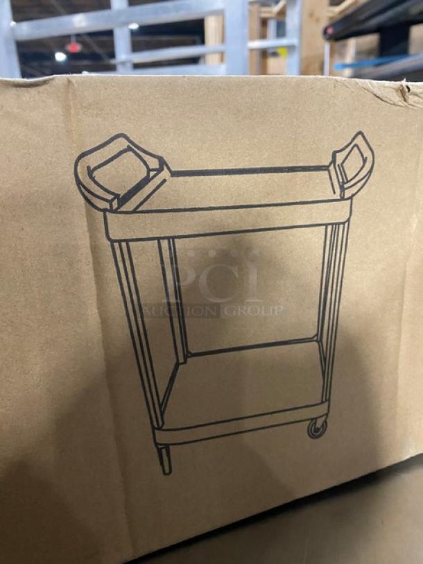 New Choice Commercial black two-shelf bus cart, 24"x16", with casters, in original packaging, illustrated on box.