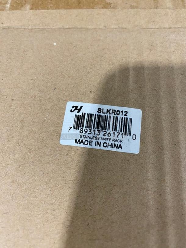 NEW Thunder Group stainless steel knife rack, model SLKR012. Features label indicating "MADE IN CHINA" and barcode.