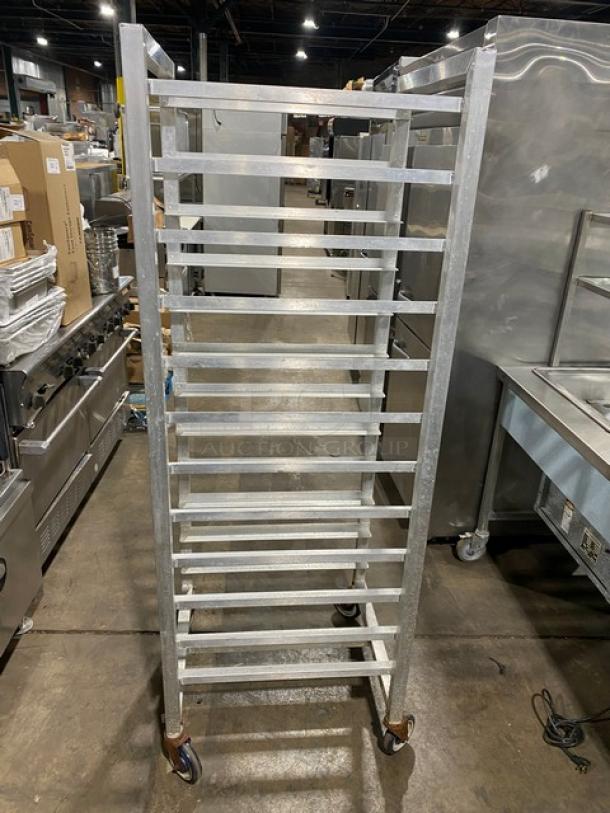 Alexander Industries commercial steam rack, stainless steel, with wheels, multiple shelves, excellent condition.