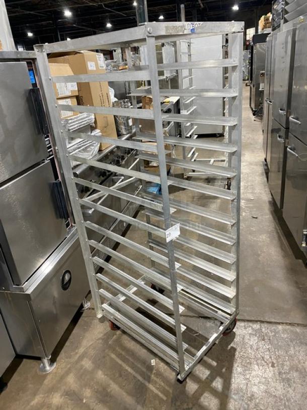 Commercial stainless steel hot food steam rack on casters, multiple shelves, durable condition, ideal for food service.