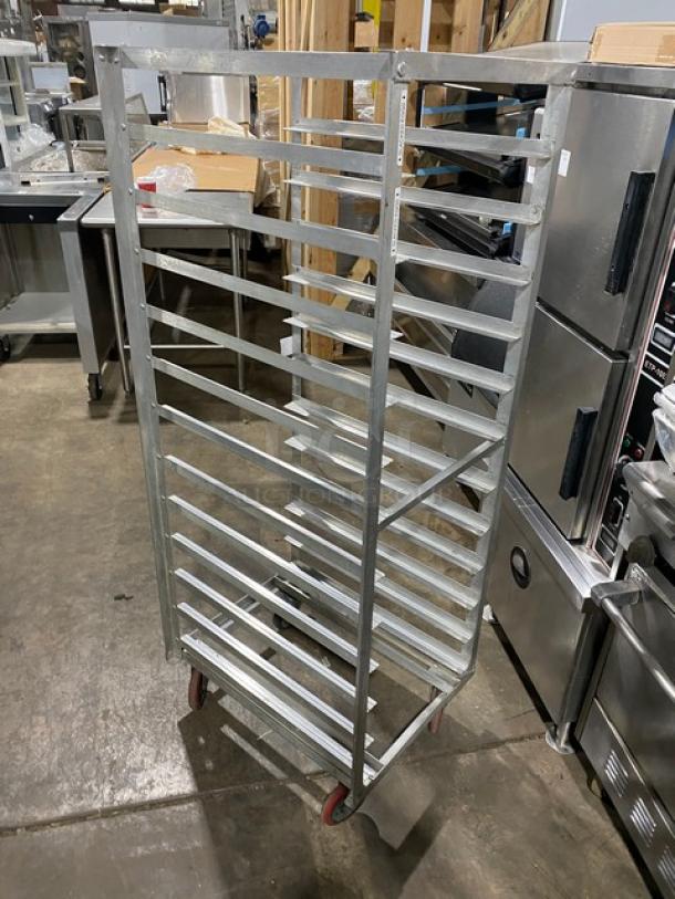 Commercial stainless steel hot food steam rack with multiple shelves, on casters for easy mobility, in good condition.