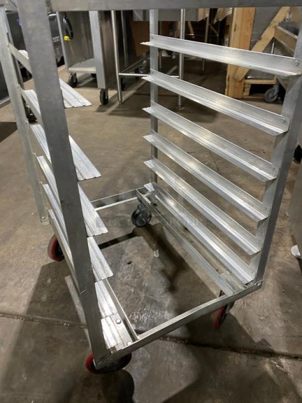 Commercial stainless steel hot food steam rack on casters, multiple shelves, durable condition, ideal for catering use.