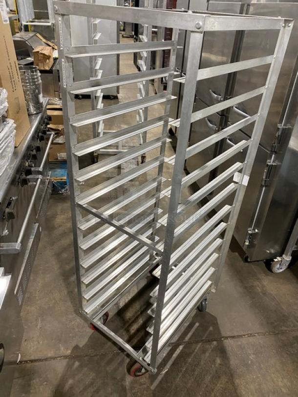 Commercial stainless steel hot food steam rack on casters; features multiple shelves, durable construction, good condition.