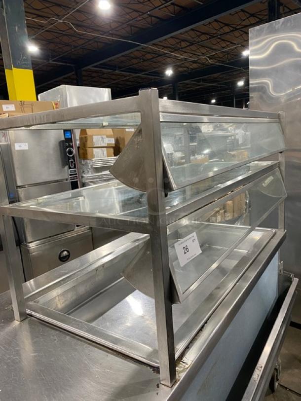 Atlas Metal stainless steel cold food bar with single well, foldable tray slide, double tier sneeze guard, on casters.