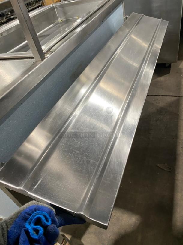 Atlas Metal stainless steel electric cold food bar, single well, with foldable tray slide and double-tier sneeze guard.