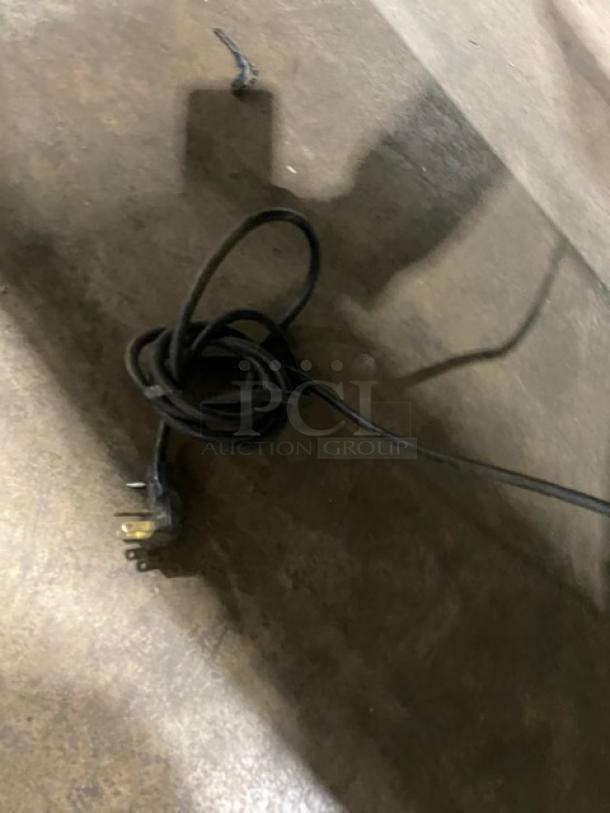 Atlas Metal commercial stainless steel electric salad bar cord on concrete floor.