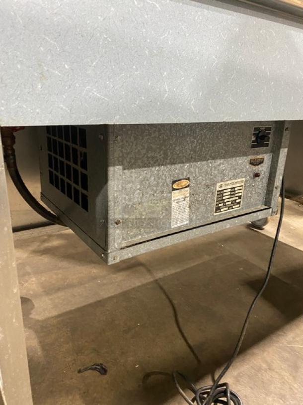 Atlas Metal stainless steel single well cold food bar, electric-powered, with foldable tray slide, double-tier sneeze guard, SN: 6756-95.