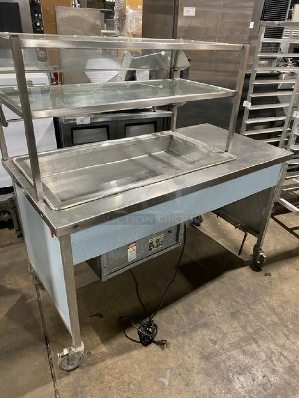 Atlas Metal stainless steel electric cold food/salad bar, single well, foldable tray slide, double tier sneeze guard, on casters.
