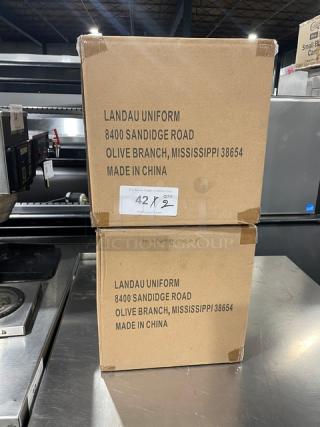 Boxes of Landau Uniforms commercial white non-woven 9" round chef hats. New condition, marked "Made in China."