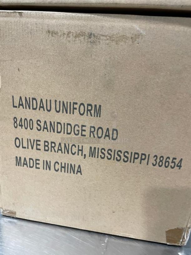 Cardboard box labeled with "Landau Uniform", address in Olive Branch, Mississippi, made in China. Box possibly contains Landau chef hats.