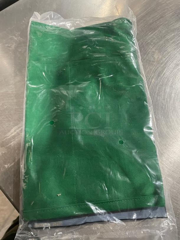 NEW Crew Ware 612BAFHGN green bib apron, unopened, with adjustable neck strap and 3 pockets, in plastic packaging.