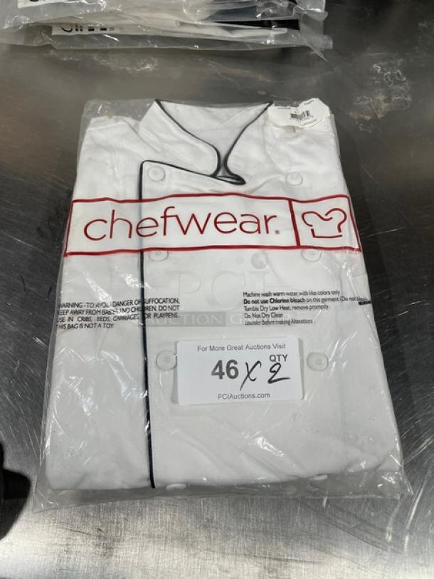 NEW Chefwear chef coat, model CW5690-CWP1, size S, with black piping, in original packaging. Brand label visible.