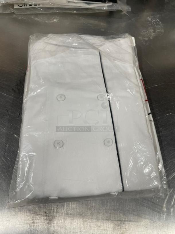 New Chefwear CW5690CWP1 white chef coat, size S, with black piping, in packaging. Perfect condition.