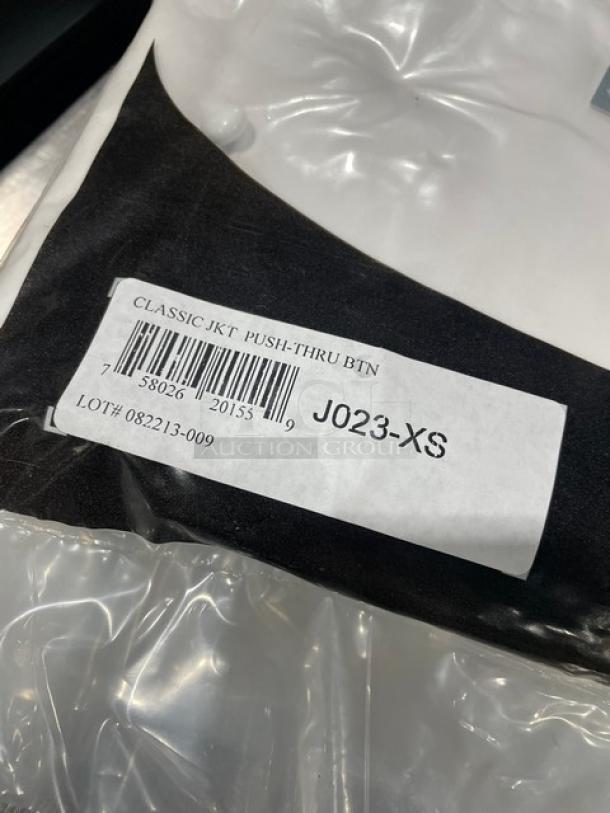 Chef Revival white chef jacket, model J023-XS, brand new in packaging with push-thru buttons. Label shows classic style and size XS.