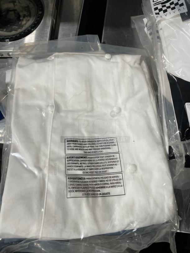 Chef Revival white chef jacket, size S, model J023S, new in packaging with push-thru buttons and warning labels visible.