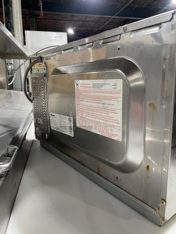 Amana RCS10TS commercial stainless steel microwave oven, electric, countertop stackable, digital controls, model-specific label visible.