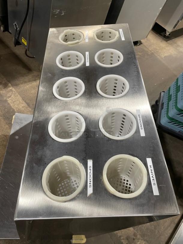 Atlas Metal TC-2-S stainless steel tray cart with cutlery holders, labeled for spoons, forks, knives. Mounted on casters.