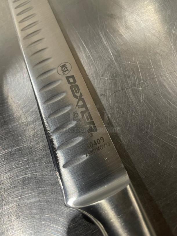 Dexter Russell I-Cut Pro Series 12" slicing knife, model 30409, stainless steel blade, black grip handle, new condition.