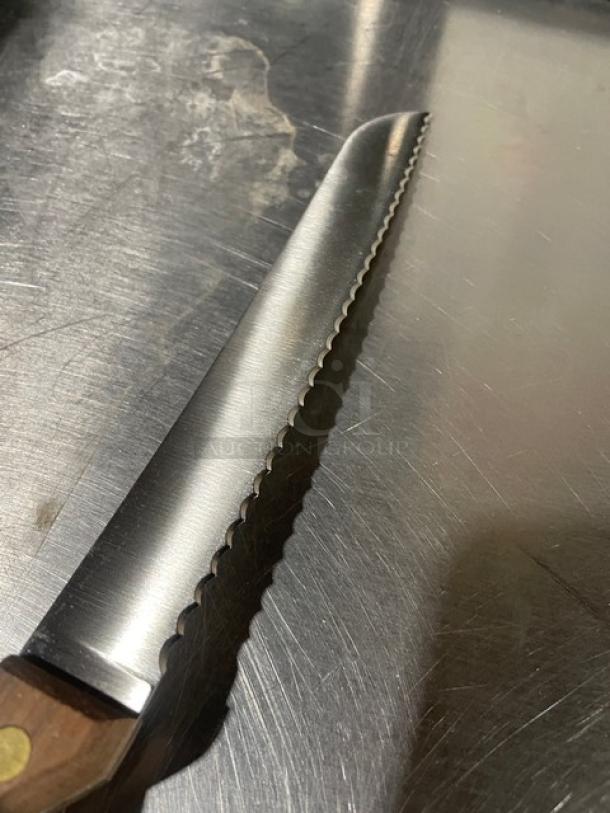 Dexter Russell 8" bread knife, stainless steel, Model 628, new condition, with traditional wooden grip handle.