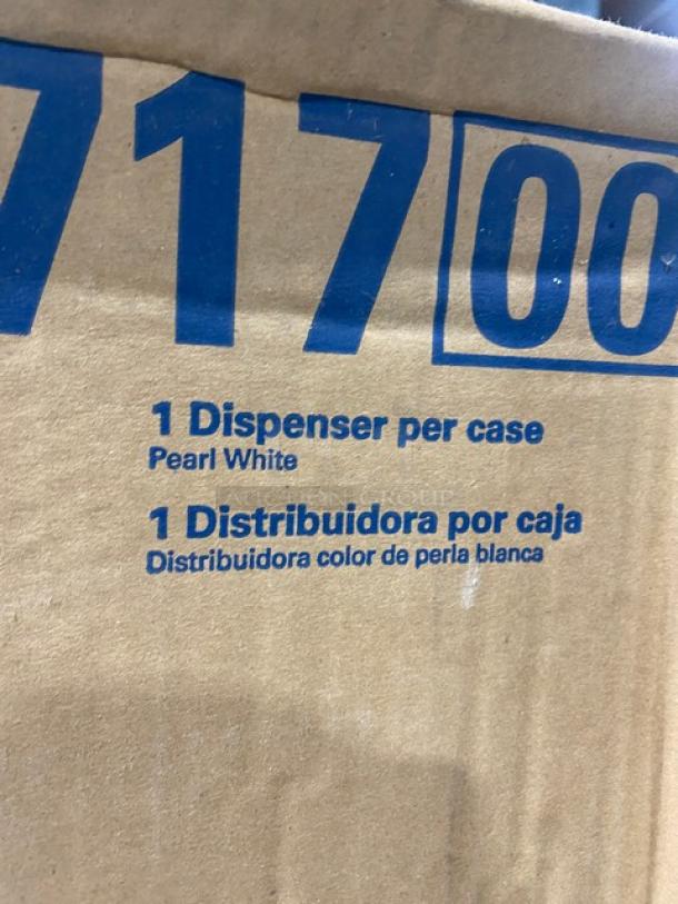 Kimberly-Clark white roll towel dispenser, model 0971700, in original packaging. Markings indicate "1 Dispenser per case, Pearl White."