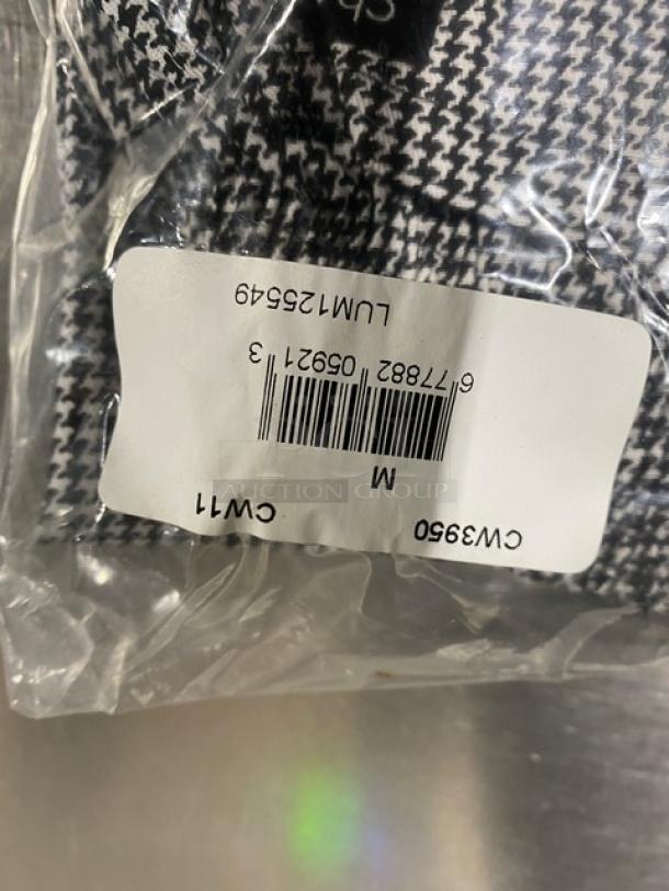 New Chefwear CW11 black and white M-size chef pants in packaging. Includes label with barcode and model details.