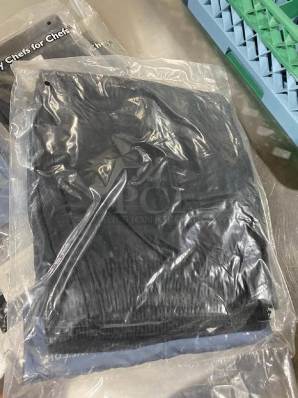 New Chef Revival black poly/cotton blend chef pants, model P014BK-2X, size 2X, slim fit, in packaging.