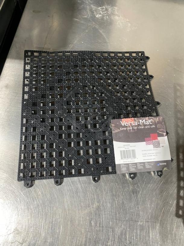 San Jamar Versa-Mat Series black interlocking bar mat, Model VM5280BK, 1' x 1', new condition with label showing features.