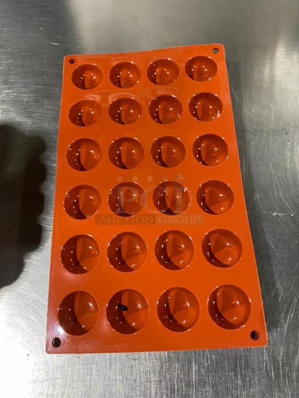 Silikomart SF009 terracotta 24-cup round non-stick platinum silicone mold. New condition, ideal for commercial use.