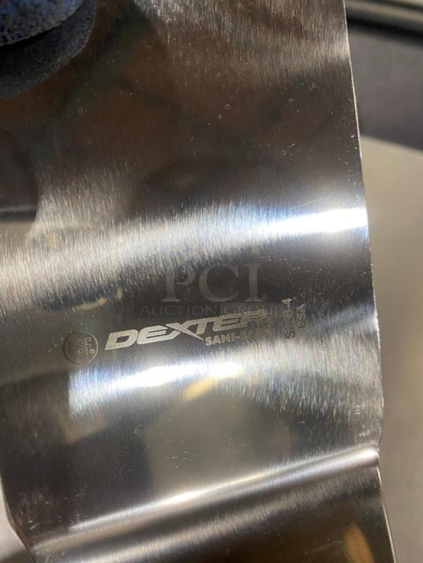 Dexter Russell Sani-Safe stainless steel hamburger turner, model S286-4, with black grip handle; NSF certified.