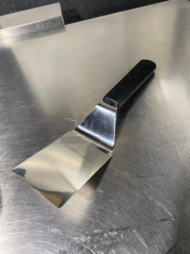 NEW Dexter Russell Sani-Safe Series stainless steel hamburger turner, model S286-4, with 4"x3" blade, black grip handle.