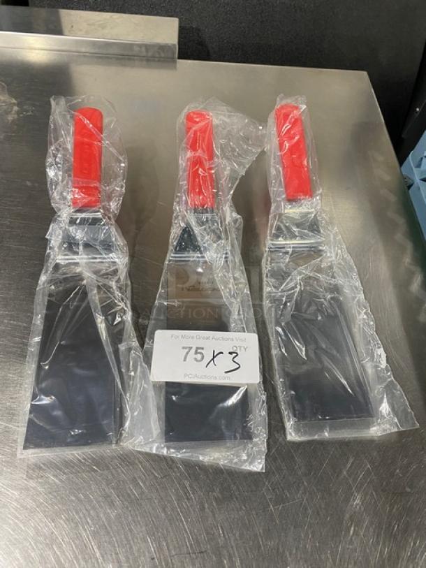 NEW Dexter Russell 8"x3" stainless steel turner, model 31989R, with red grip handle, in original packaging.