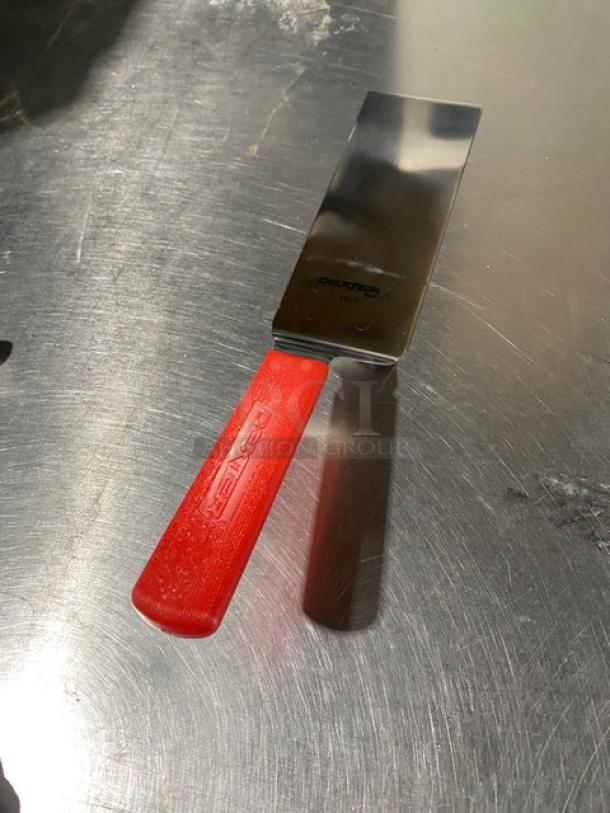 New Dexter Russell Commercial 8" x 3" stainless steel turner with red grip handle, model 31989R, pristine condition.