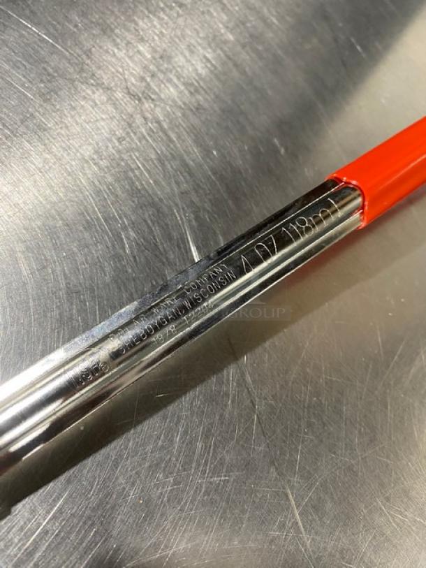 Polar Ware stainless steel ladle, 4 oz capacity, red handle, new condition, markings show 4 oz/118 ml and manufacturer details.