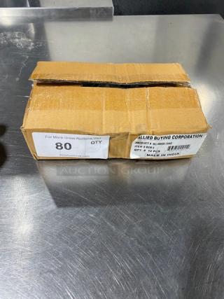 Cardboard box labeled with "ABC Commercial Stainless Steel 3 Oz Bell Creamer, Model BCR-3, Made in India," on a metal surface.