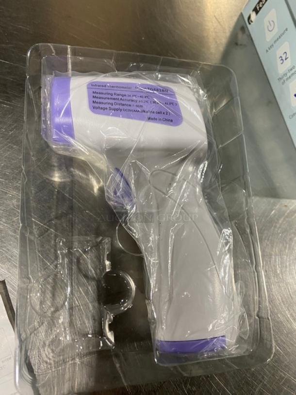 New commercial infrared non-contact forehead thermometer, model TG8818N, in packaging. Measures 32°F-212°F, made in China.