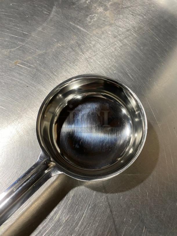 ABC stainless steel 6 oz portion serving spoon, Model PPG6S, with black grip handle. New condition.