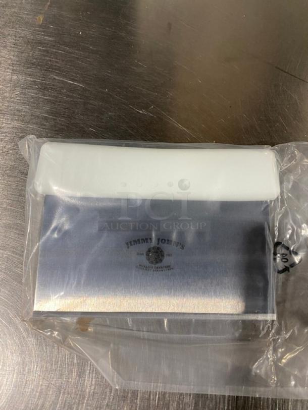 New Jimmy John's style stainless steel dough cutter with a white grip handle, in packaging.