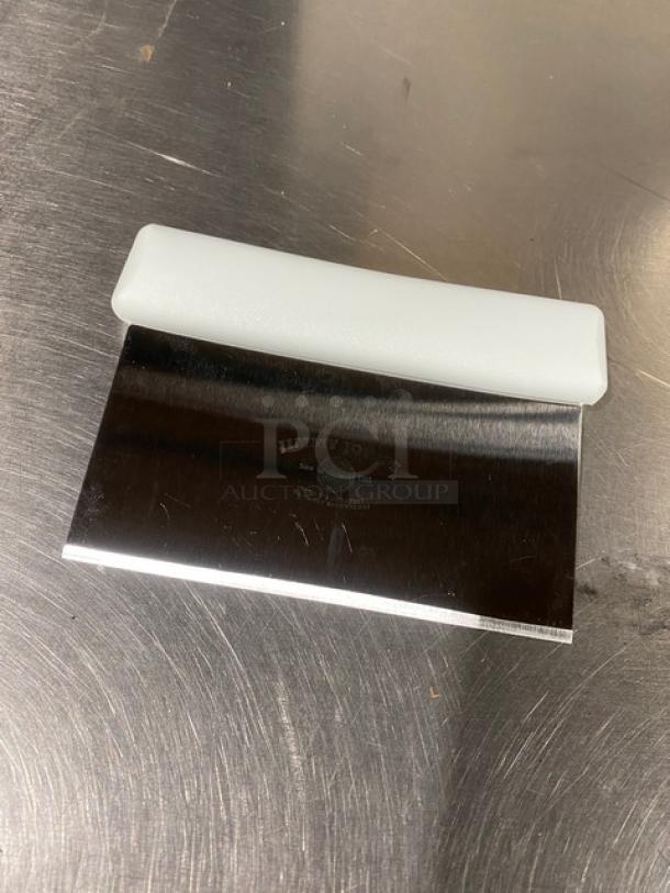 Jimmy John's style stainless steel dough cutter with white grip handle, new condition, brand marking visible.